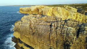 Aerial View Of Sea Waves Breaking On Rocky Shore At Sunset 1