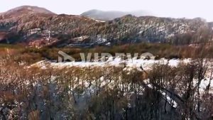 Aerial shot of snowy mountain road