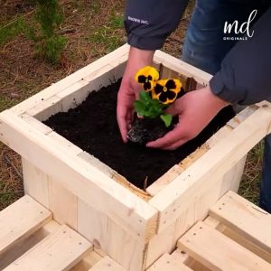 Construct wooden planter benches from pallets
