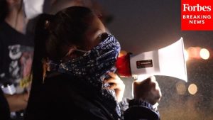Dramatic Footage Shows Standoff Between Protesters And ICE Agents During CA Raid