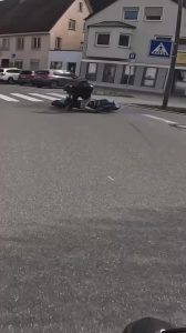 Biker Loses Control While Turning and Falls on Road