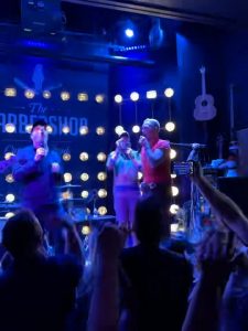 Brendan Hunt and Jason Sudeikis sing “Mr. Brightside” at The Barbershop in Las Vegas