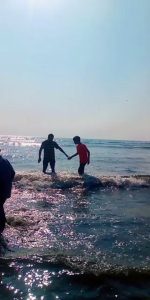 at the beach with friend