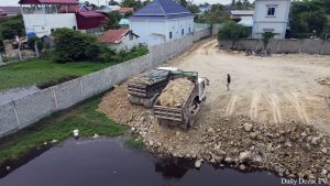 wonderful Nice action Building Road by mini dozer d20P pushing Stone and truck unloading stone