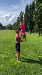 Daughter Balances Handstand on Dad's Arm